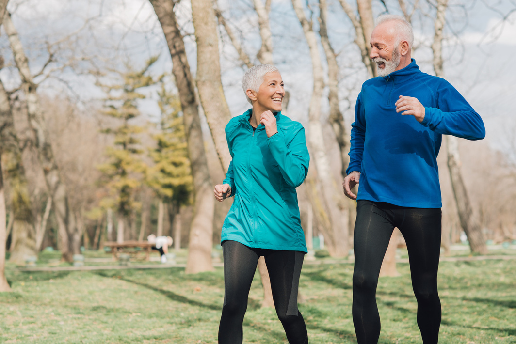 Elderly joggers exercising outdoors